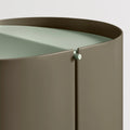 Blu Dot Binwell Wastebasket in Dark Olive detail shot showing swing-top lid hinge mechanism