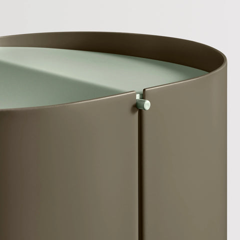 Blu Dot Binwell Wastebasket in Dark Olive detail shot showing swing-top lid hinge mechanism