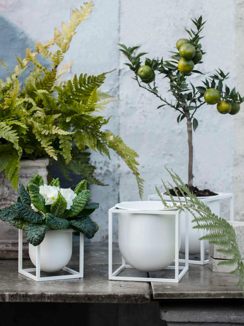 white metal flower pots by audo copenhagen