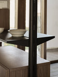 String Furniture Pira Pole in black grey holding a steel shelf, detail beside a wood side table