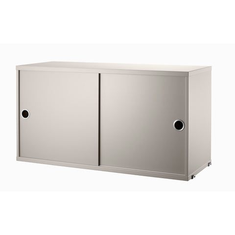 String Furniture cabinet with sliding doors in beige – versatile Scandinavian storage unit
