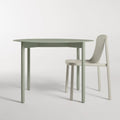 Comeuppance Round Dining Table by Blu Dot in Grey Green, styled with Decade Chair in Putty