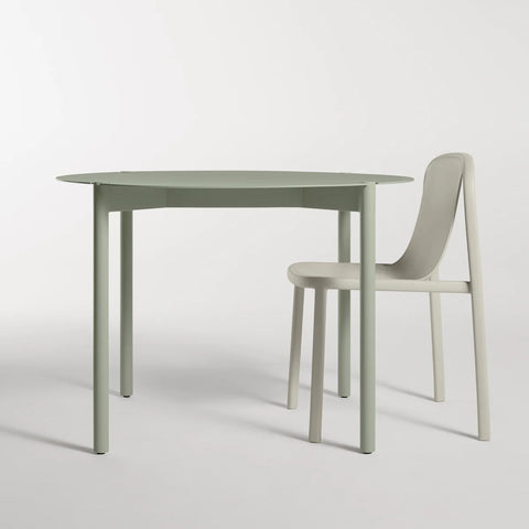 Comeuppance Round Dining Table by Blu Dot in Grey Green, styled with Decade Chair in Putty