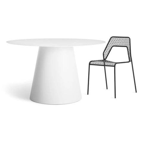 Circula 52" Dining Table by Blu Dot in White, styled with Hot Mesh Chair in Black
