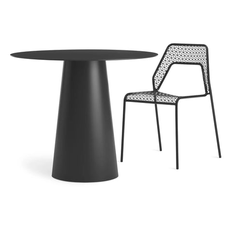 Circula 36" Dining Table by Blu Dot in Oblivion, styled with Hot Mesh Chair in Black