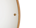 Frama CM-1 Circle Mirror, detail of the mirror edge where the oak rim meets the glass and a brass knob sits on the face