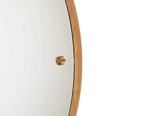 Frama CM-1 Circle Mirror, detail of the mirror edge where the oak rim meets the glass and a brass knob sits on the face