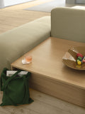 Close-up of Connect Sofa Table in oak veneer – minimalist design with modern accessories