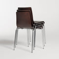 Blu Dot Chair Chair in Graphite on Oak stacked three high showing chrome legs on white background