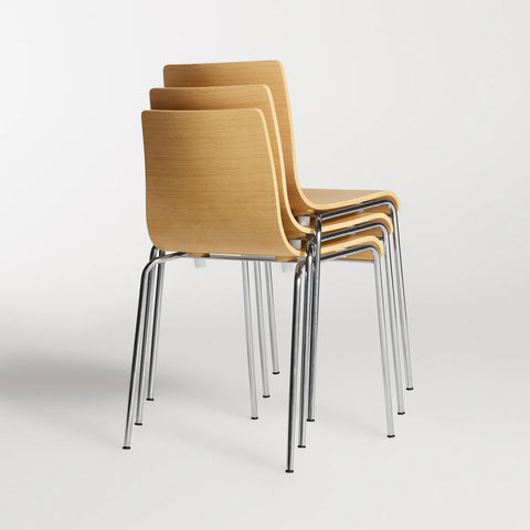 Blu Dot Chair Chair in Technical White Oak stacked three high showing chrome legs on white background