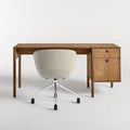 Blu Dot Cursive Desk in walnut rear view showing round cutout drawer pulls with Host task chair on white background