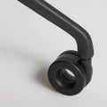 Blu Dot Clean Cut Task Chair close-up detail of the black powder-coated aluminum leg and caster wheel