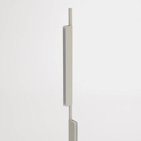 Blu Dot Cowl Floor Lamp in putty finish, close-up detail of one of the two independently pivoting shades on the slender powder-coated aluminum stalk