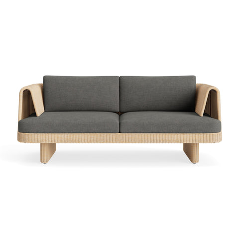 Loophole Outdoor 2 Seat Sofa by Blu Dot in all-weather rattan with Toohey Charcoal Sunbrella cushions, front view