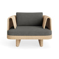 Loophole Outdoor Lounge Chair by Blu Dot in all-weather rattan with Toohey Charcoal Sunbrella cushion, front view