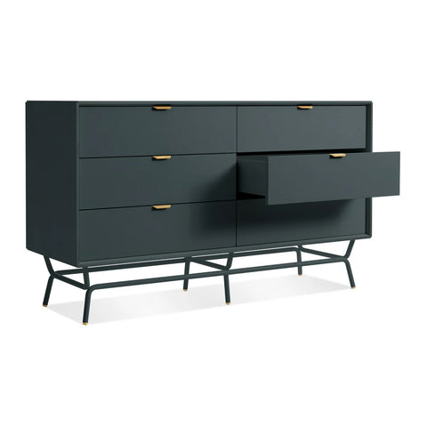 Blu Dot Dang 6 Drawer Dresser in navy green painted oak veneer with matching powder-coated steel legs and antique brass pulls, shown at an angle with one drawer open