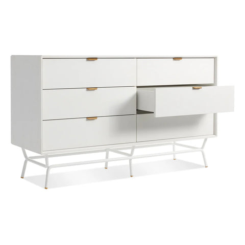 Blu Dot Dang 6 Drawer Dresser in white painted oak veneer with white powder-coated steel legs and antique brass pulls, shown at an angle with one drawer open