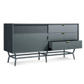 Blu Dot Dang 1 Door / 3 Drawer Console in marine blue painted oak veneer with matching perforated steel door front, antique brass pulls, and powder-coated steel legs, shown at an angle with one drawer open