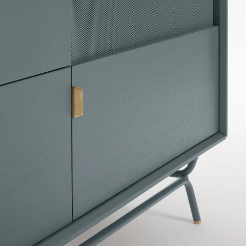 Blu Dot Dang 2 Door / 2 Drawer Console close-up detail in marine blue painted oak veneer with matching perforated steel door fronts, antique brass pulls, and powder-coated steel legs