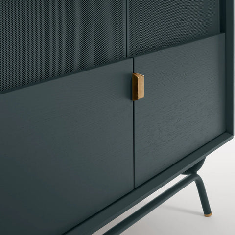 Blu Dot Dang Media Stand close-up detail in navy green painted oak veneer with matching perforated steel door front, antique brass pull, and powder-coated steel leg