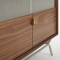 Blu Dot Dang Media Stand close-up detail in walnut veneer with grey perforated steel door front, antique brass pull, and putty powder-coated steel leg