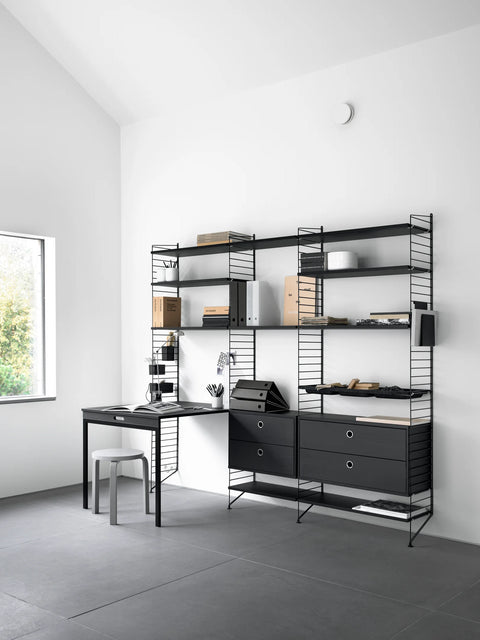 Black String® System shelving with matching folding table in minimalist office