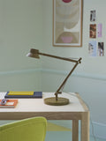 dedicate table lamp by muuto in brown green on scandinavian desk lifestyle image 