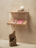 Compact String™ shelving unit with Magazine Shelf in oak finish, Scandinavian wall-mounted display