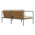 Blu Dot Dog Days Outdoor 2 Seat Sofa in Sunbrella Linen cushions with charcoal powder-coated aluminum frame and all-weather rattan, shown from the back to display the woven rattan panels
