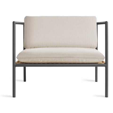 Blu Dot Dog Days Outdoor Lounge Chair in Sunbrella Linen cushions with charcoal powder-coated aluminum frame and all-weather rattan