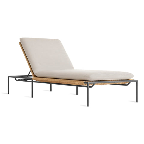 Blu Dot Dog Days Outdoor Sun Lounger in Sunbrella Linen cushion with charcoal powder-coated aluminum frame and all-weather rattan