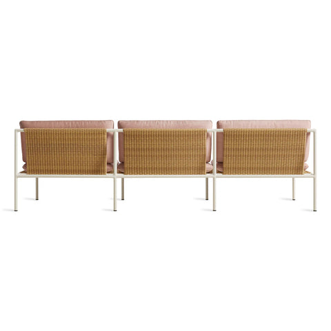 Dog Days Outdoor 3 Seat Sofa by Blu Dot in Sunbrella Blush / White, rear view showing all-weather rattan back panel