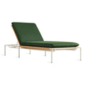 Blu Dot Dog Days Outdoor Sun Lounger in Sunbrella Ivy green cushion with white powder-coated aluminum frame and all-weather rattan