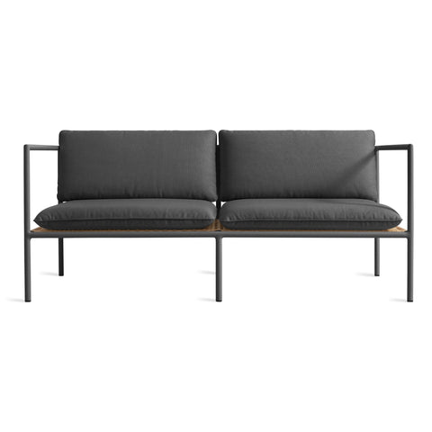 Blu Dot Dog Days Outdoor 2 Seat Sofa in Sunbrella Coal black cushions with charcoal powder-coated aluminum frame and all-weather rattan