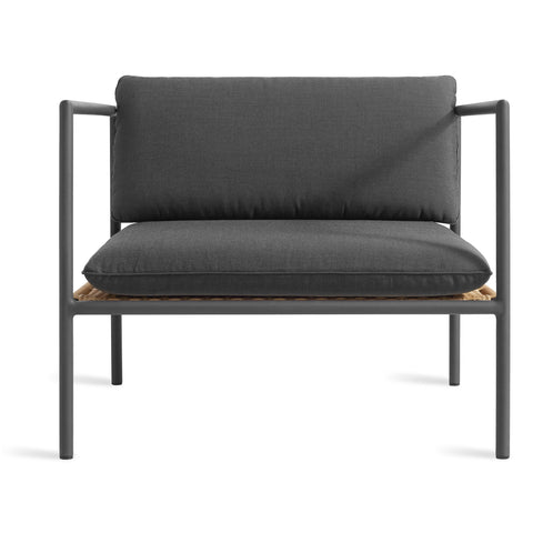 Blu Dot Dog Days Outdoor Lounge Chair in Sunbrella Coal black cushions with charcoal powder-coated aluminum frame and all-weather rattan