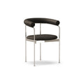 DK3 Baia dining chair fully upholstered in Rio Black 0500 leather with a chrome frame, angled view on a white background