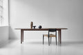 DK3 Kia's Table in smoked oak with a paper cord chair in a white room