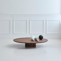 DK3 Plush Coffee Table in smoked oak in a white panelled room
