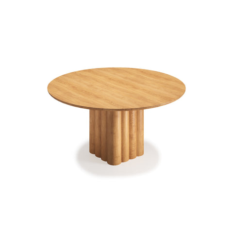 DK3 Plush Table Round in Oiled Oak, round solid wood dining table on a sculpted cube base, angled view on white