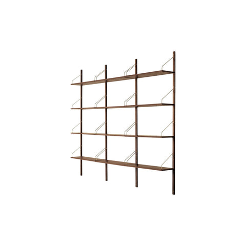 Royal System Shelving 3 Bay by Poul Cadovius for DK3 in walnut with brass hangers, four rails and twelve shelves, angled view