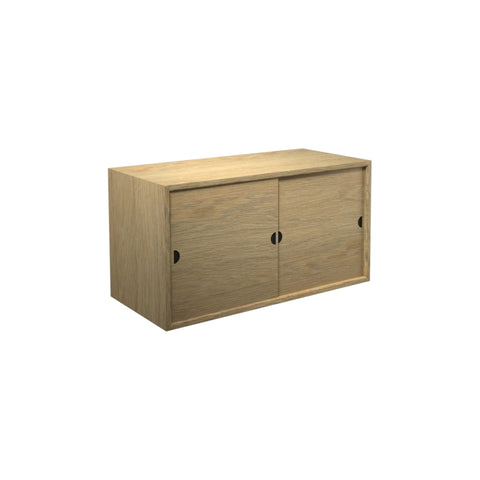 DK3 Royal System cabinet with two sliding wood doors in lacquered oak, on a white background
