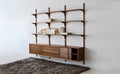 DK3 System Cado rails in smoked oak with shelves above a row of wall mounted cabinets