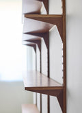 DK3 System Cado smoked oak rail and shelves, side view along the wall
