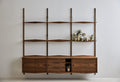 DK3 System Ultra in walnut, rails with shelves above three wall mounted cabinets