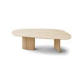 DK3 Tangent Table Rectangular in Soaped Oak, solid wood dining table with an asymmetrical top and sculptural base, angled view on white