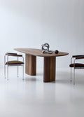 DK3 Tangent Table Rectangular in smoked oak with chrome framed chairs in a white room