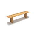 DK3 Ten Bench in Oiled Oak, solid wood dining bench with grooved legs and a curved top, angled view on white
