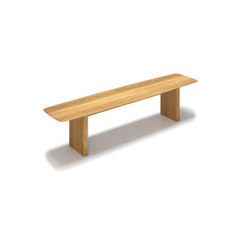DK3 Ten Bench in Oiled Oak, solid wood dining bench with grooved legs and a curved top, angled view on white