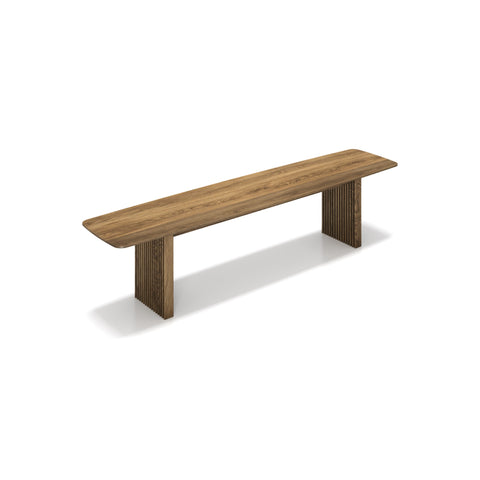 DK3 Ten Bench in Smoked Oak, solid wood dining bench with grooved legs and a curved top, angled view on white