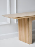 DK3 Ten Bench in soaped oak, close view of the grooved leg